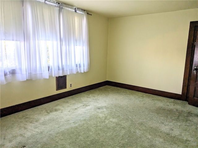 empty room featuring carpet floors