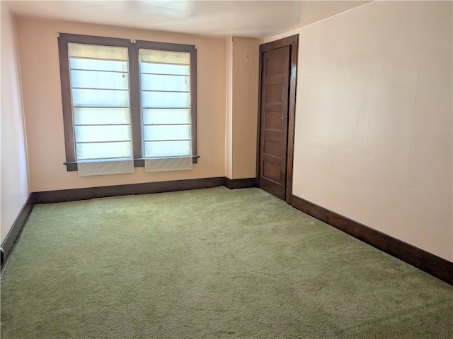 empty room with light colored carpet