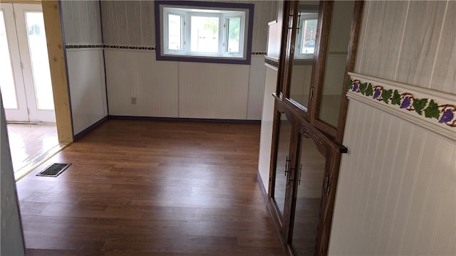 spare room featuring dark hardwood / wood-style flooring