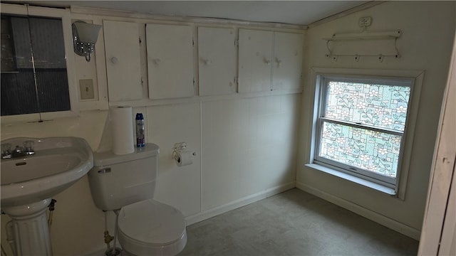 bathroom featuring toilet and lofted ceiling