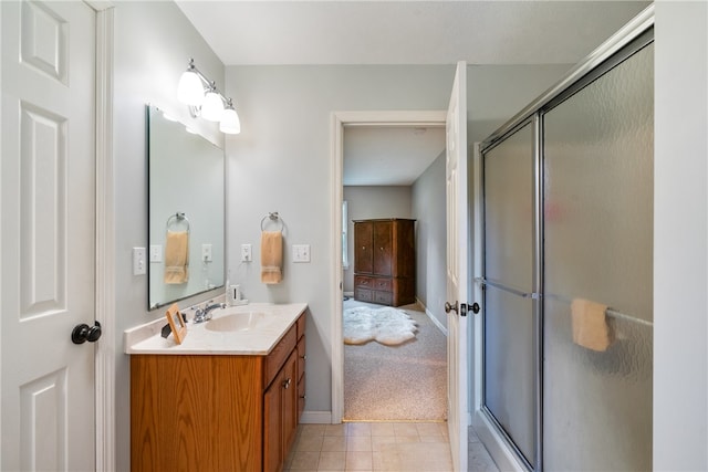 bathroom featuring vanity, tile patterned floors, and an enclosed shower