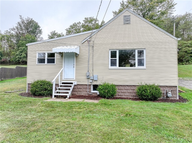 view of front of property with a front lawn