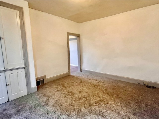 unfurnished room with carpet flooring