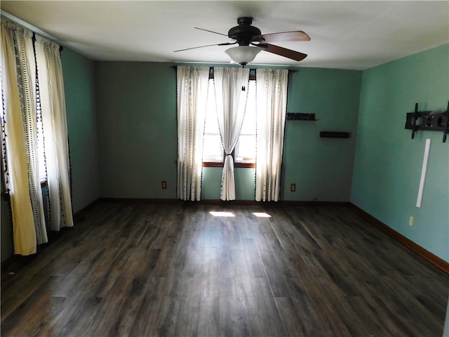 unfurnished room featuring ceiling fan and dark wood-type flooring