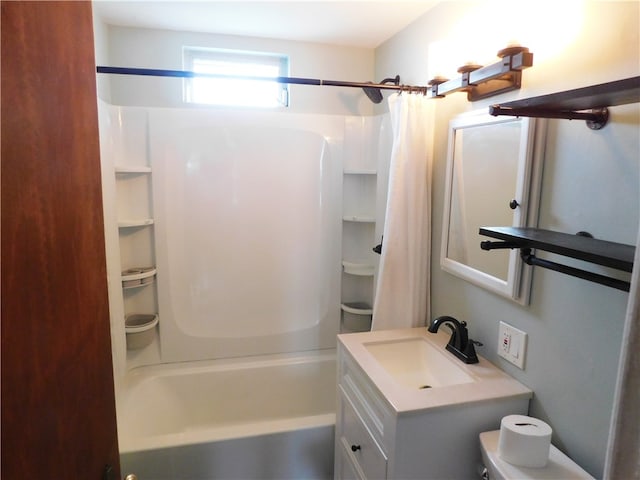 full bathroom featuring shower / bath combo, vanity, and toilet