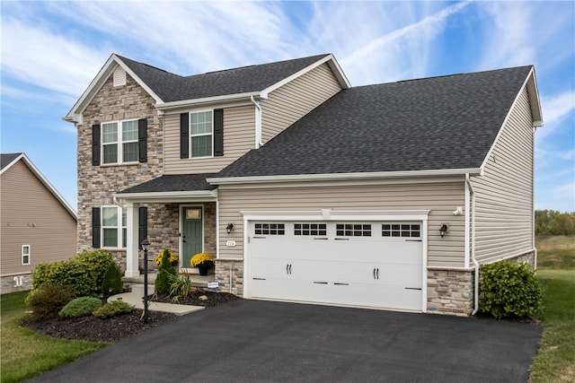 view of front of home with a garage