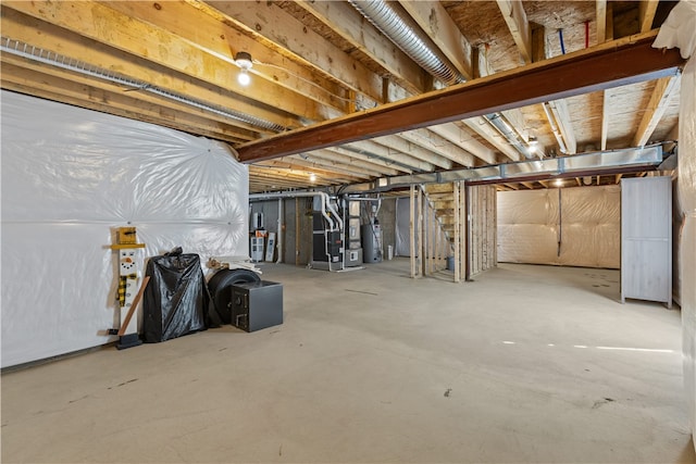 basement with gas water heater and heating unit