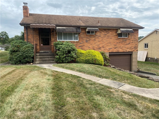 view of front of house with a front lawn and a garage