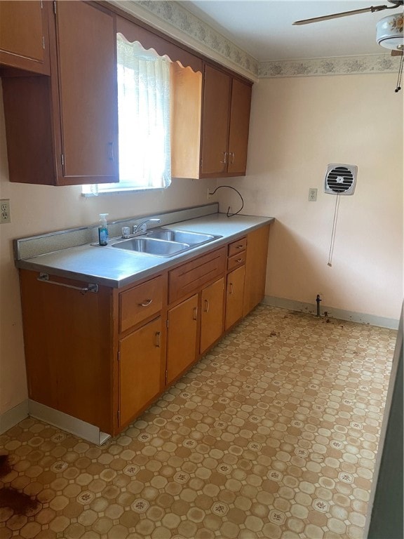 kitchen featuring sink and ceiling fan