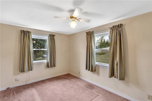 unfurnished room featuring carpet and ceiling fan