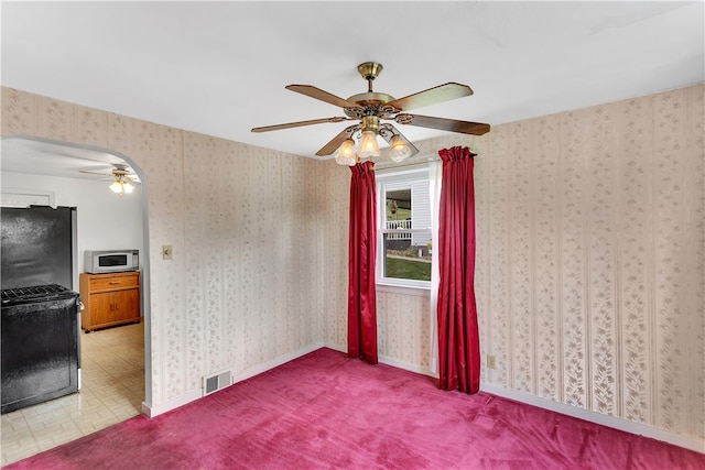 spare room featuring ceiling fan