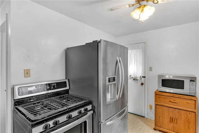 kitchen featuring appliances with stainless steel finishes and ceiling fan