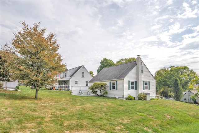 rear view of house with a lawn