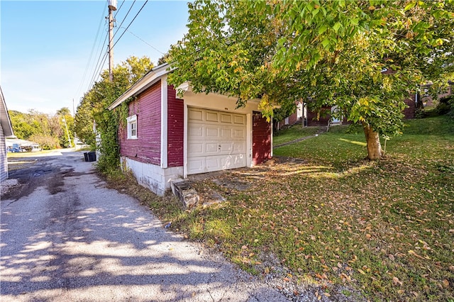 garage with a yard