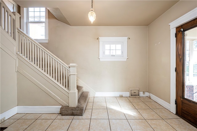 entrance foyer with light tile patterned floors