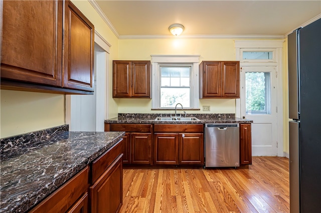 kitchen with light hardwood / wood-style flooring, a wealth of natural light, sink, and stainless steel dishwasher