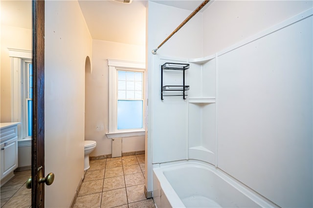 full bathroom with tile patterned flooring, bathing tub / shower combination, vanity, and toilet