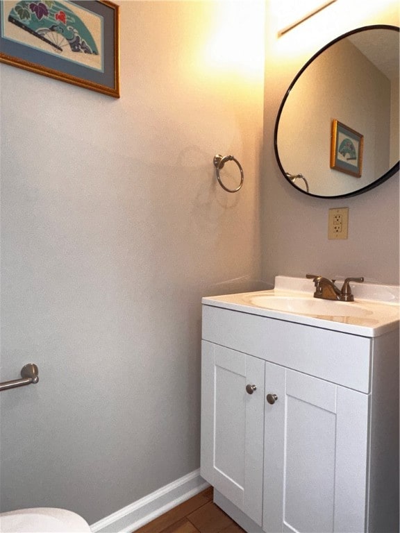 bathroom with vanity and toilet