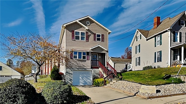 front facade featuring a garage and a front yard