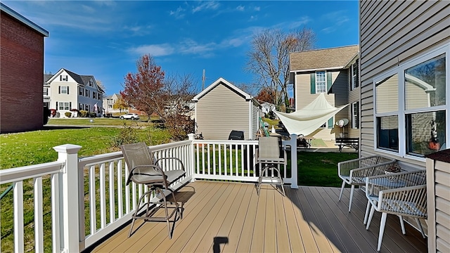 deck featuring a lawn