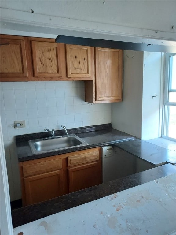 kitchen featuring sink and tasteful backsplash