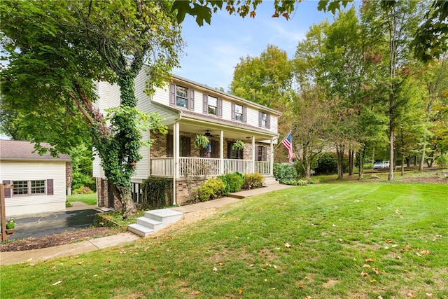 view of front of home featuring a front yard and a porch