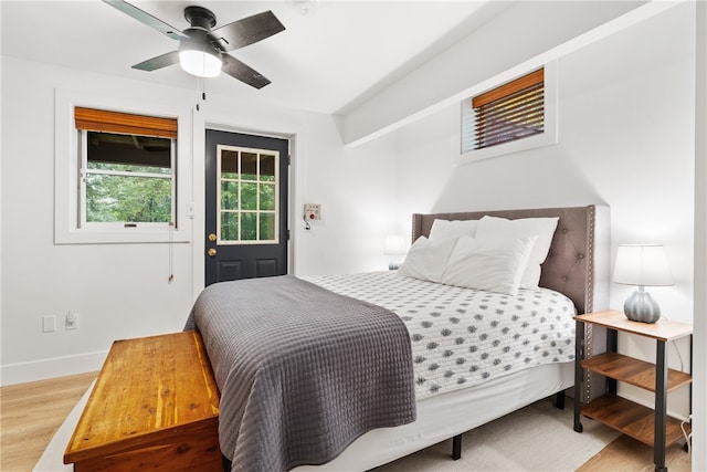 bedroom featuring hardwood / wood-style floors and ceiling fan