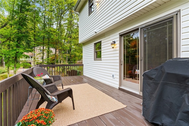 wooden deck featuring area for grilling