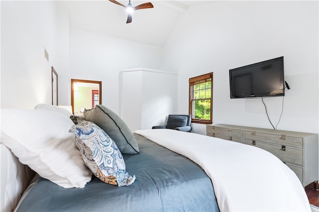 bedroom featuring high vaulted ceiling, beamed ceiling, hardwood / wood-style floors, and ceiling fan