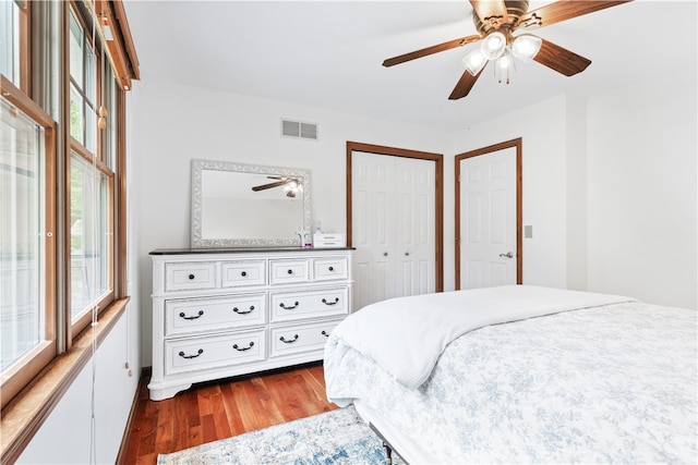 bedroom featuring a closet, hardwood / wood-style floors, and ceiling fan