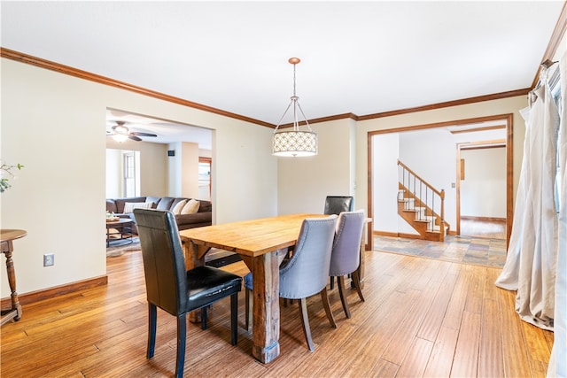 dining room with ornamental molding, ceiling fan, and light hardwood / wood-style floors