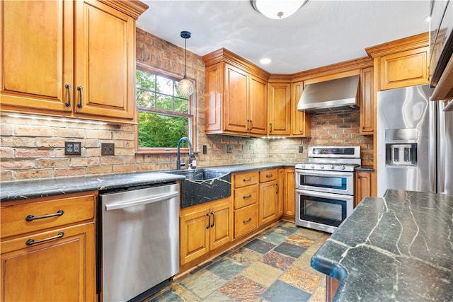 kitchen featuring stainless steel appliances, extractor fan, decorative light fixtures, decorative backsplash, and sink