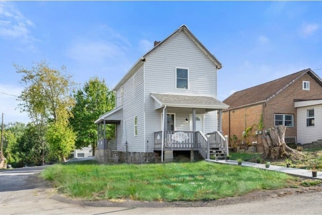 view of front of home featuring a porch and a front lawn