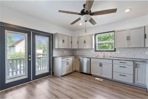 kitchen featuring ceiling fan, sink, french doors, dishwasher, and light hardwood / wood-style floors