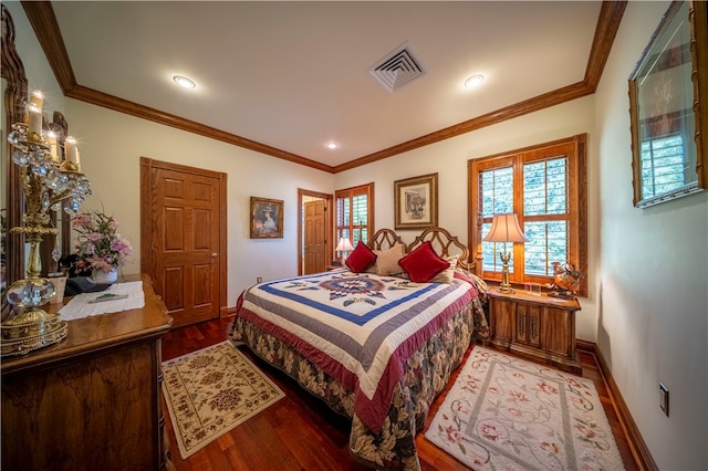 bedroom featuring ornamental molding and hardwood / wood-style flooring