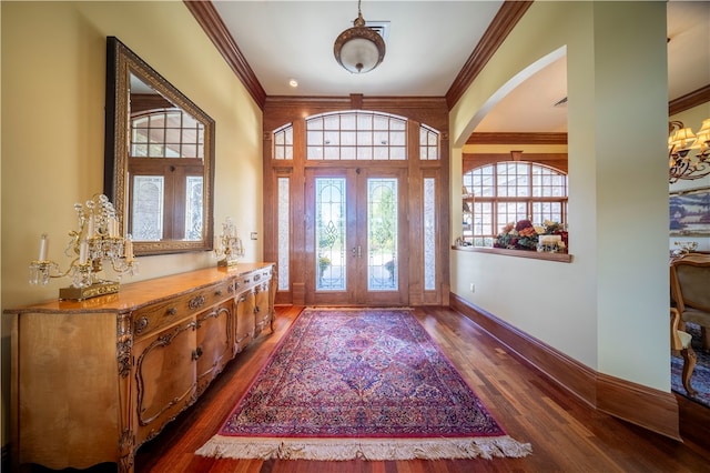 entryway featuring ornamental molding and dark wood-type flooring