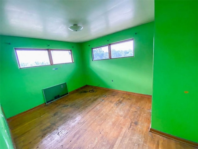 unfurnished room with light hardwood / wood-style floors