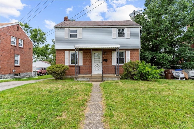 1099 George St, Sharon, PA 16146 - colonial-style house featuring a front lawn, brick siding, and a chimney