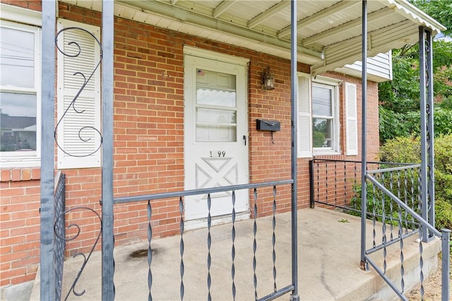 1099 George St, Sharon, PA 16146 - property entrance with brick siding and covered porch