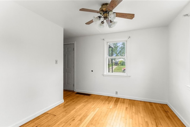 unfurnished room with ceiling fan and light hardwood / wood-style flooring