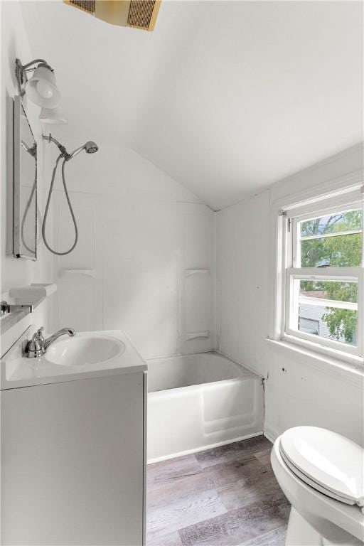 1099 George St, Sharon, PA 16146 - bathroom featuring wood finished floors, toilet, lofted ceiling, and vanity