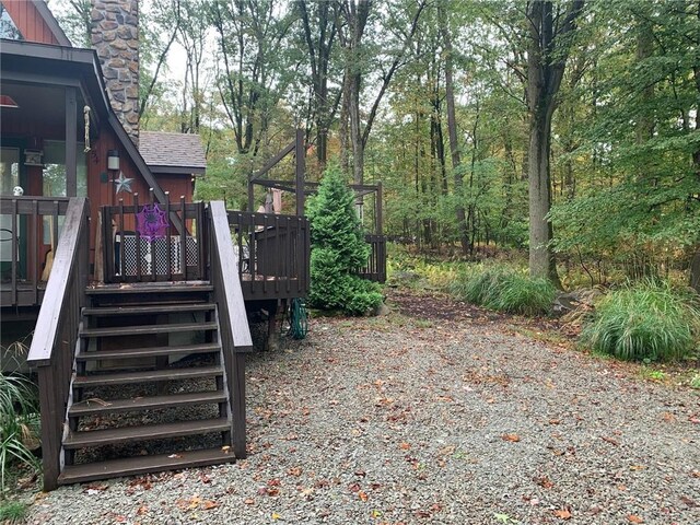 exterior space featuring a wooden deck and stairway