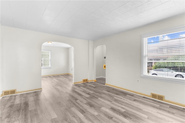 spare room featuring light hardwood / wood-style flooring