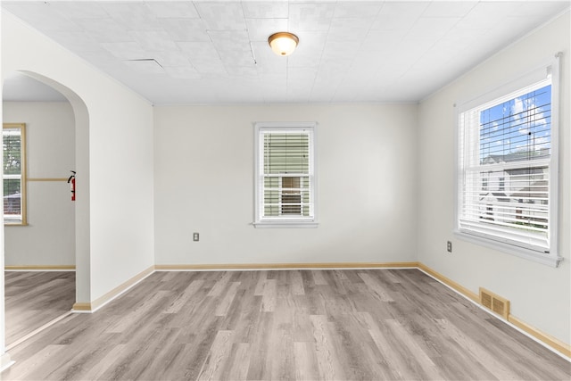 spare room with light hardwood / wood-style floors