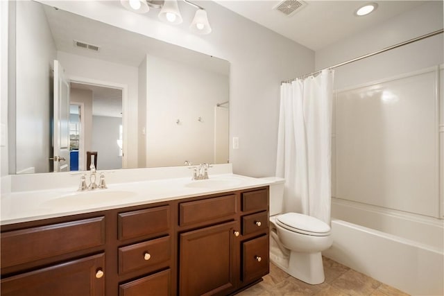 full bathroom featuring tile patterned flooring, vanity, toilet, and shower / bathtub combination with curtain