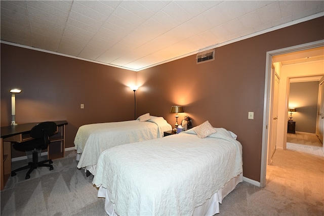 carpeted bedroom with crown molding