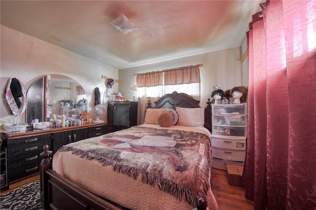 bedroom featuring dark hardwood / wood-style flooring