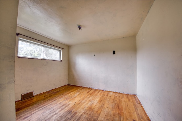 spare room with light hardwood / wood-style floors