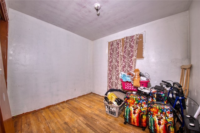 recreation room with wood-type flooring