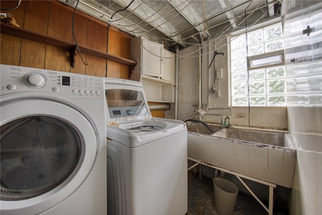 washroom with washer and clothes dryer and sink